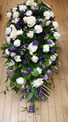 Purple and white casket spray