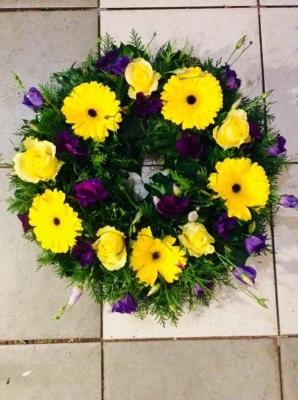 Yellow Gerbera and roses loose open wreath