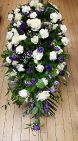 Purple and white casket spray