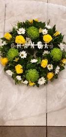 Green and yellow loose open wreath